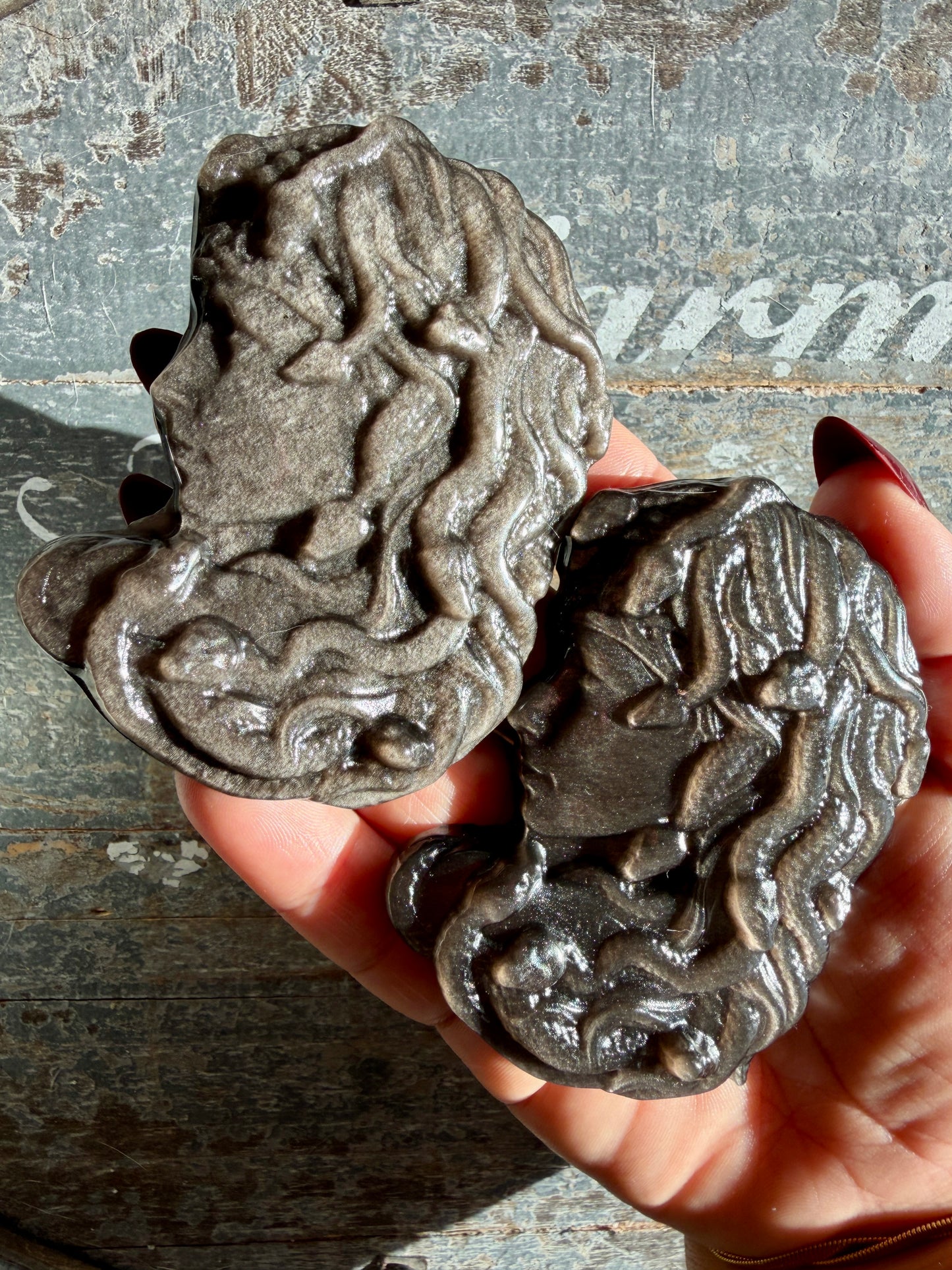 One (1) Silver Sheen Obsidian Medusa