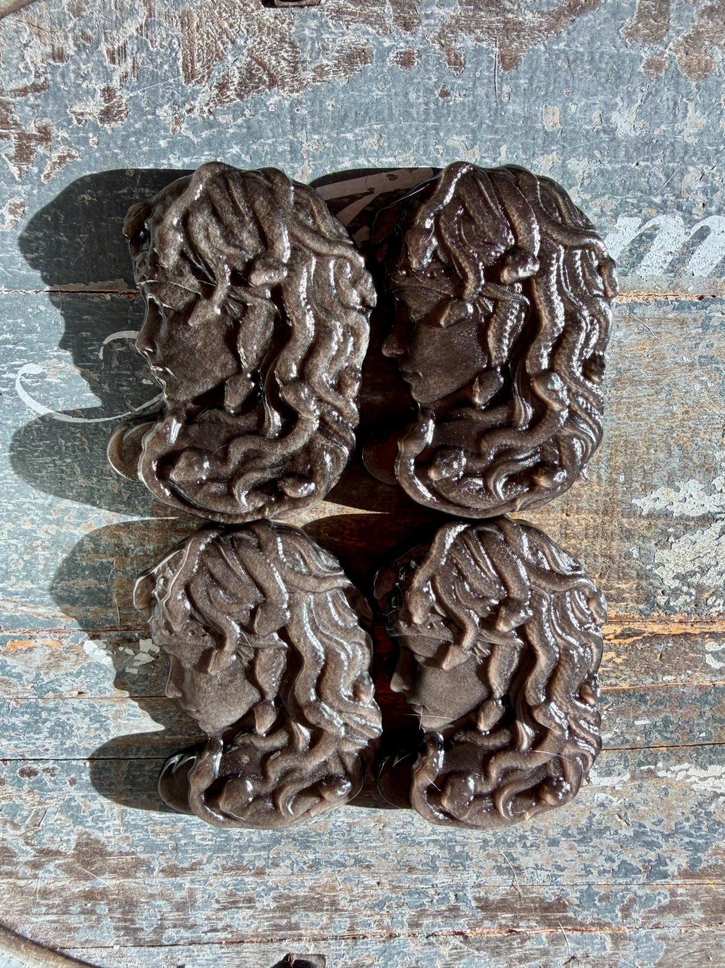 One (1) Silver Sheen Obsidian Medusa