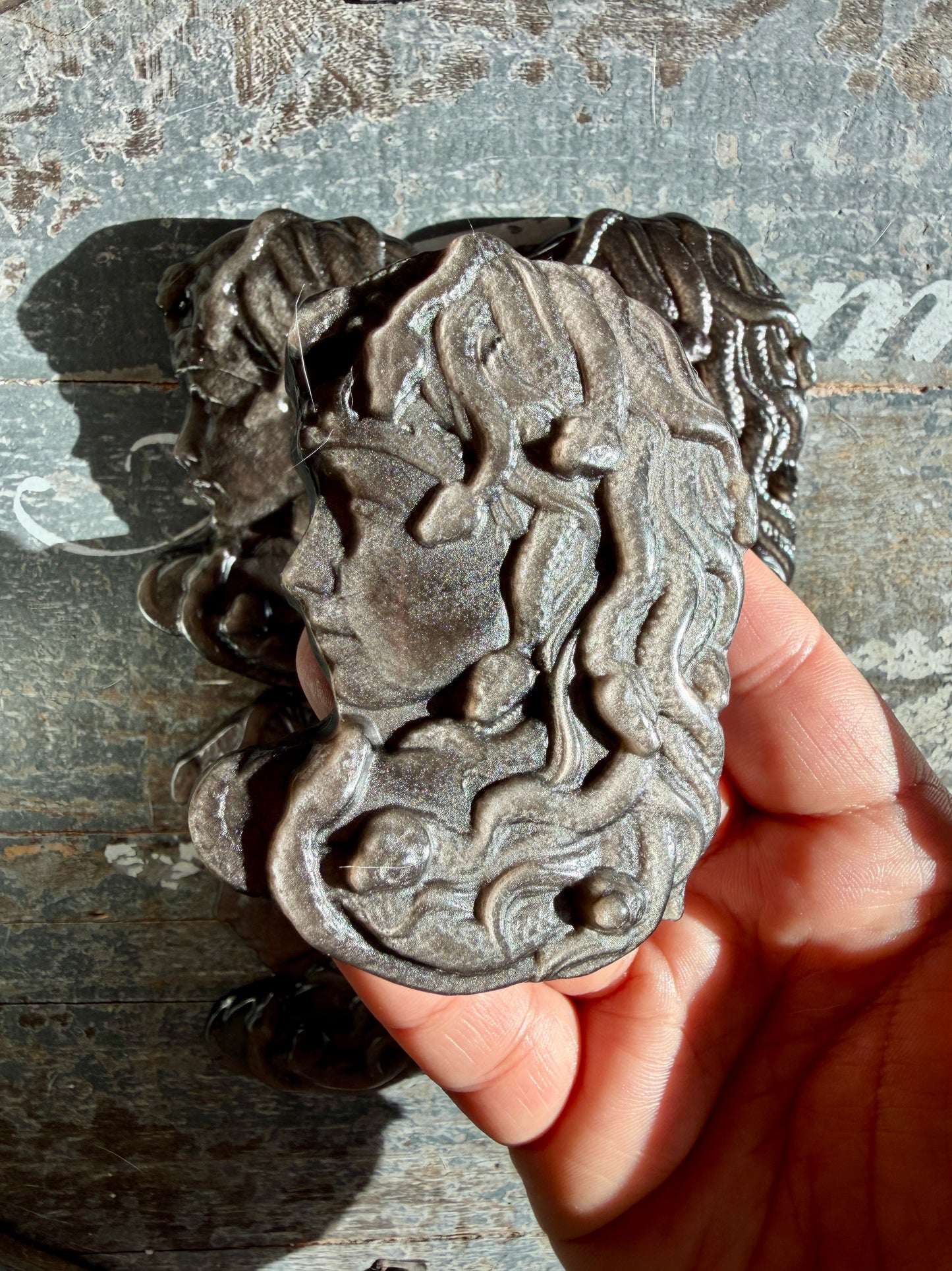 One (1) Silver Sheen Obsidian Medusa