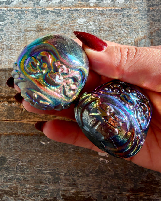 One (1) Titanium Aura Daruma doll (smaller)