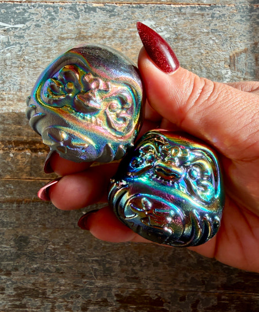 One (1) Titanium Aura Daruma doll (smaller)