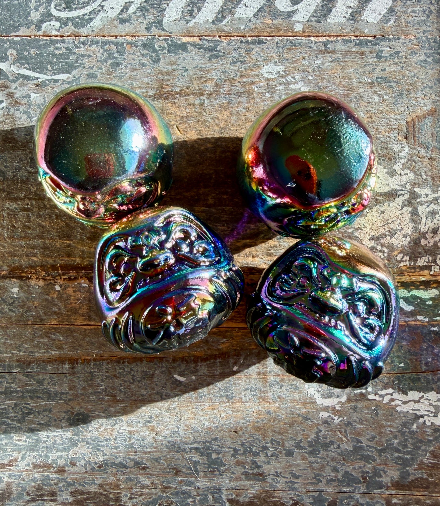 One (1) Titanium Aura Daruma doll (smaller)