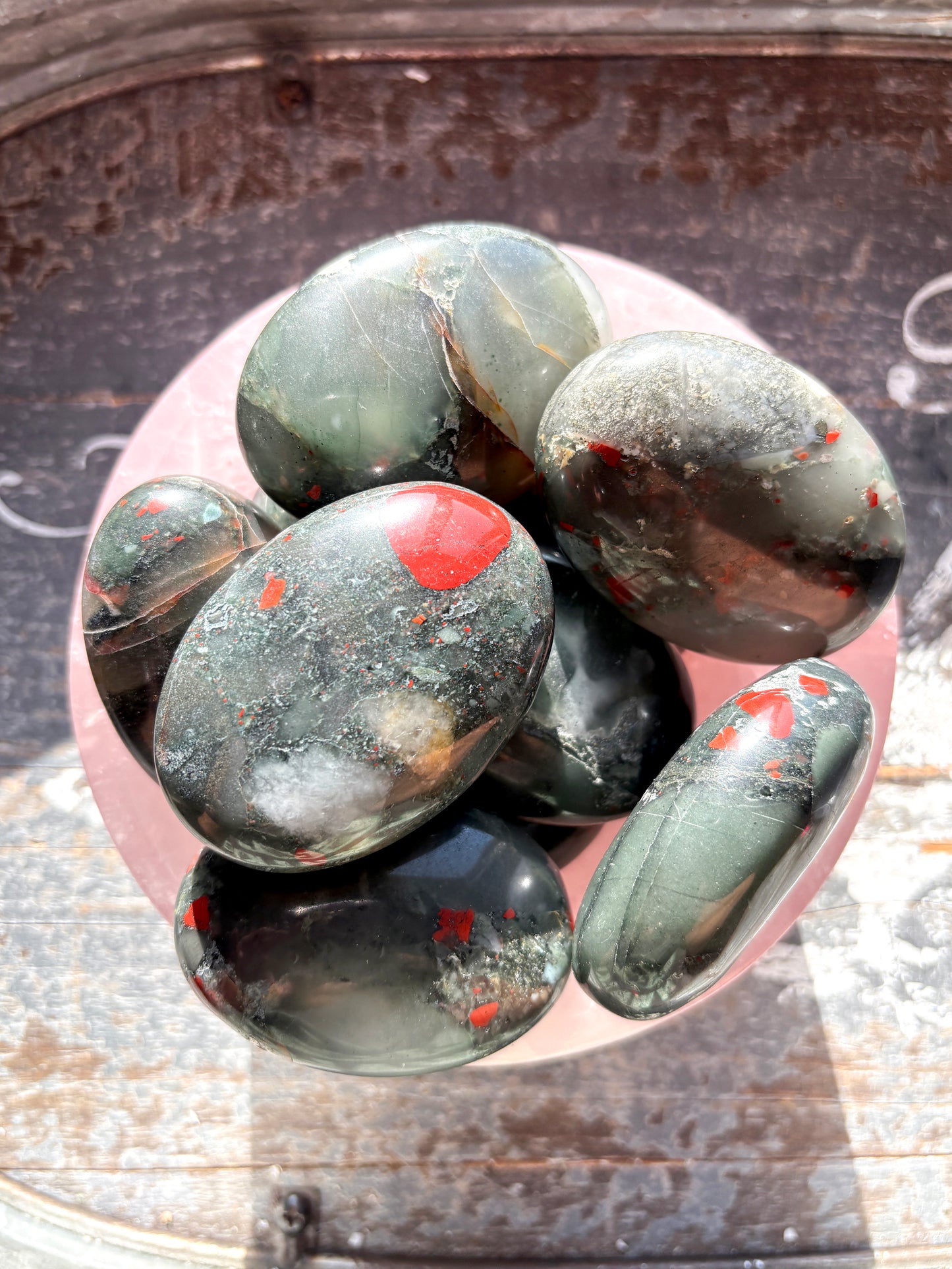 One (1) African Bloodstone Palmstone, intuitively chosen