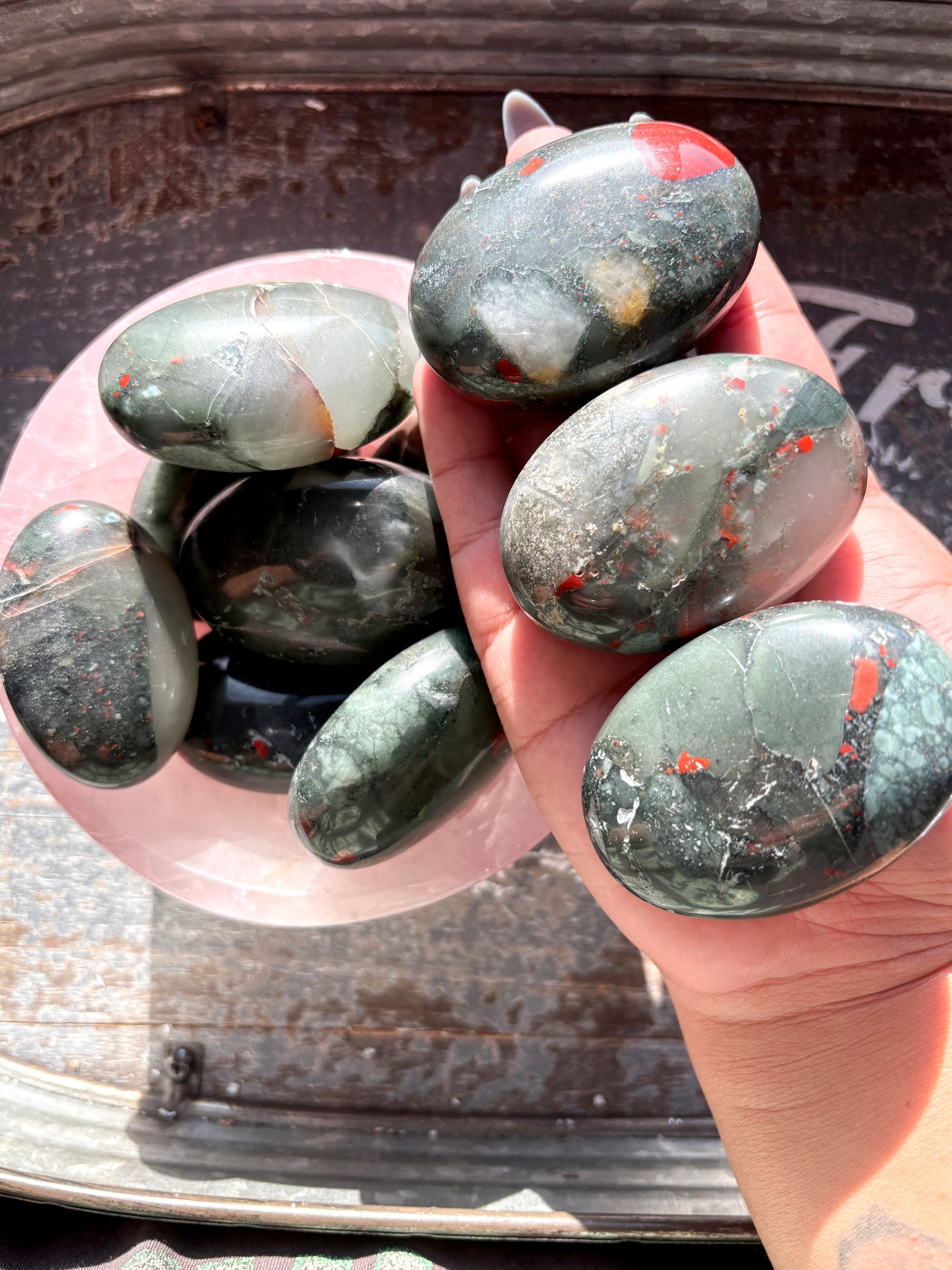 One (1) African Bloodstone Palmstone, intuitively chosen