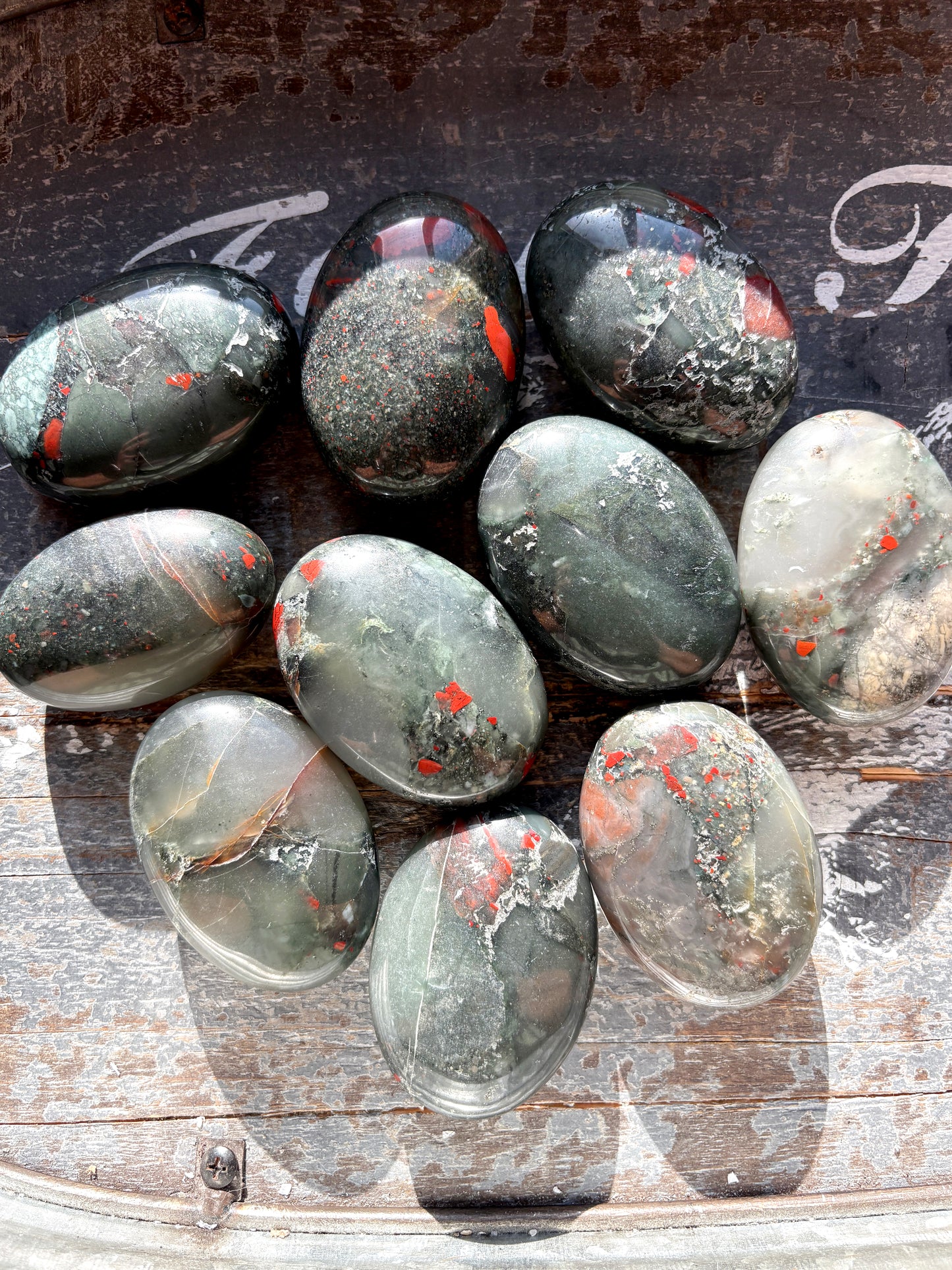 One (1) African Bloodstone Palmstone, intuitively chosen