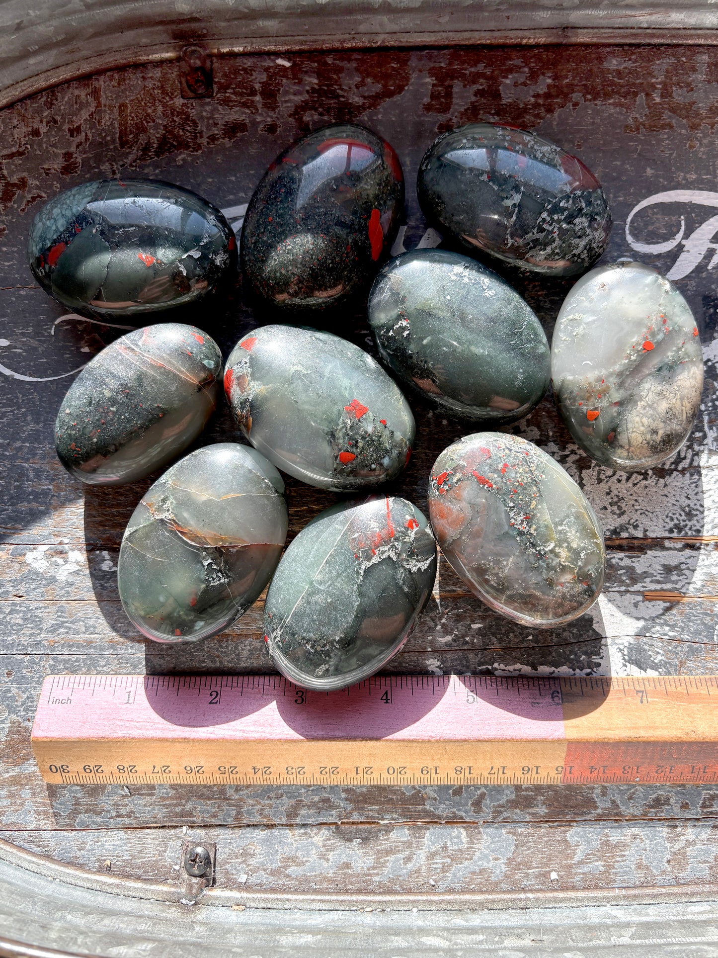 One (1) African Bloodstone Palmstone, intuitively chosen